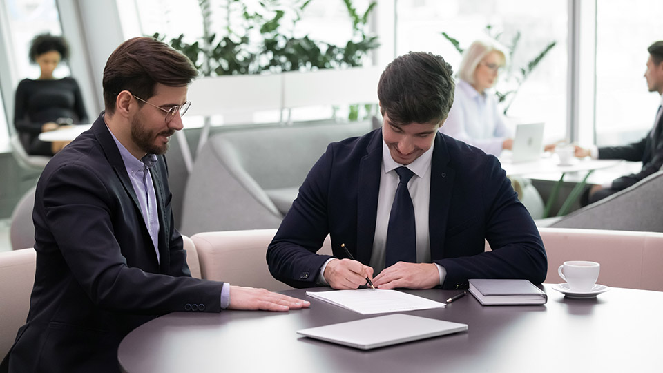 Happy,Young,Caucasian,Male,Employee,Put,Signature,On,Document,Close